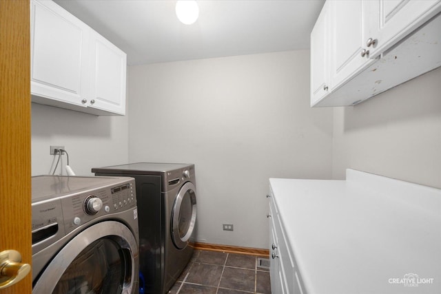 2355 Avalon Ct, Aurora, IL 60503 - washroom with cabinet space, washing machine and clothes dryer, and dark tile patterned floors