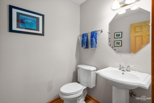2355 Avalon Ct, Aurora, IL 60503 - half bathroom featuring toilet and baseboards