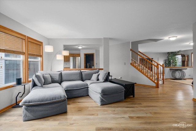 2355 Avalon Ct, Aurora, IL 60503 - living room with stairway, light wood-type flooring, and baseboards