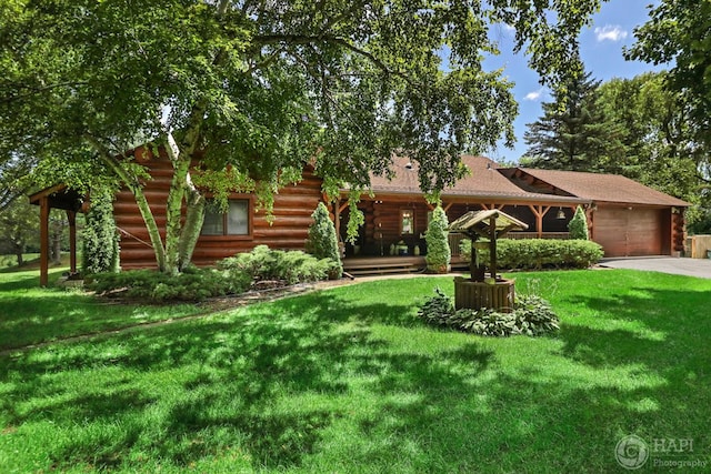 39575 N Dilleys Rd, Wadsworth, IL 60083 - view of front of home with a garage, a front yard, driveway, and log exterior