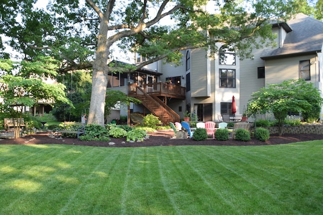 view of yard featuring stairway and a wooden deck