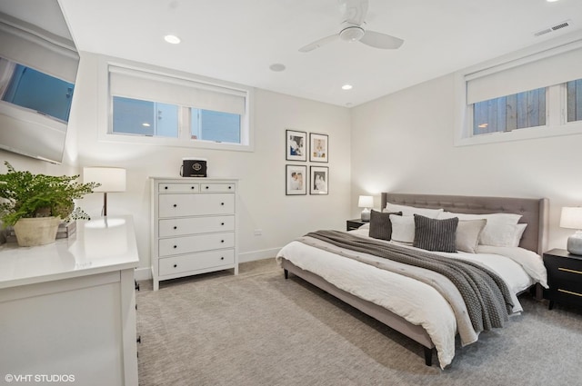 bedroom with recessed lighting, visible vents, light carpet, and baseboards