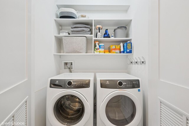 laundry area featuring laundry area and washing machine and dryer