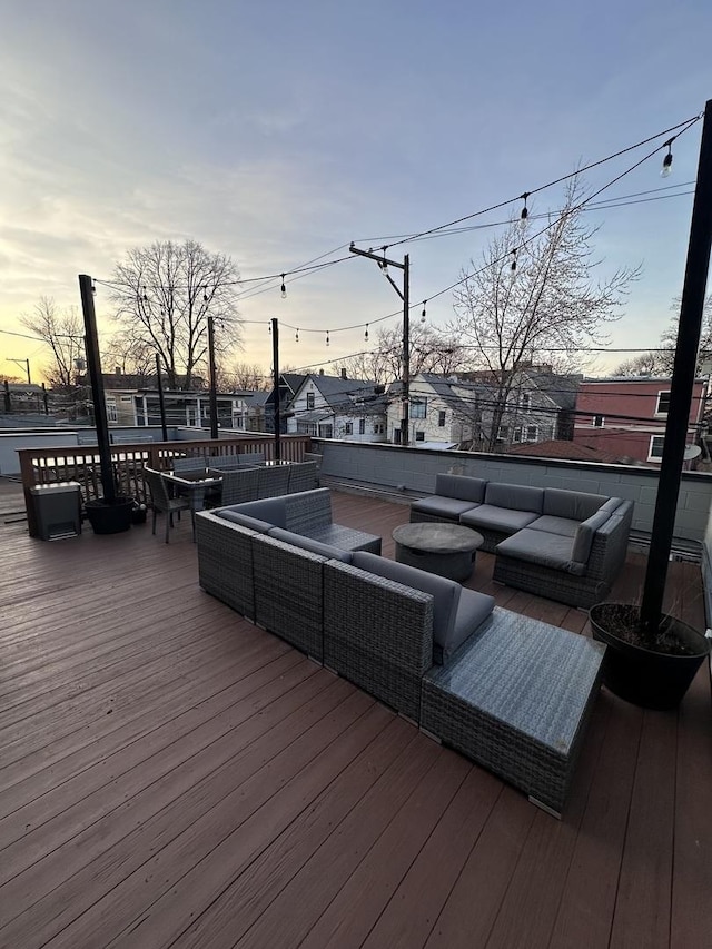 wooden deck featuring an outdoor living space