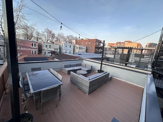 wooden deck featuring an outdoor hangout area