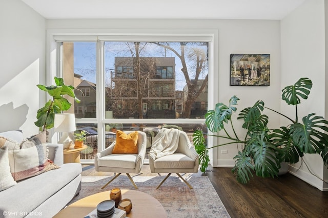 interior space featuring baseboards and wood finished floors