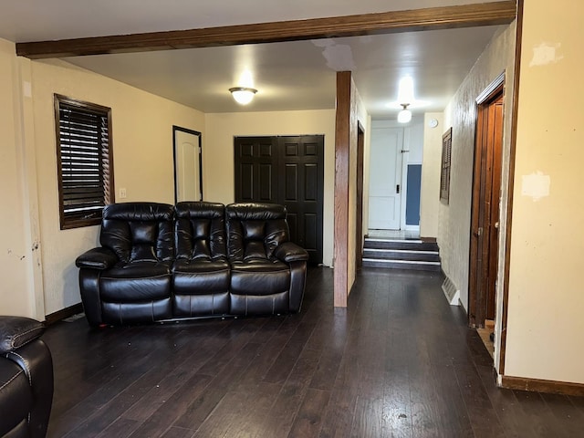 living area featuring stairs, baseboards, and dark wood-style flooring