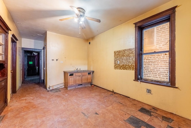 spare room featuring ceiling fan and light floors