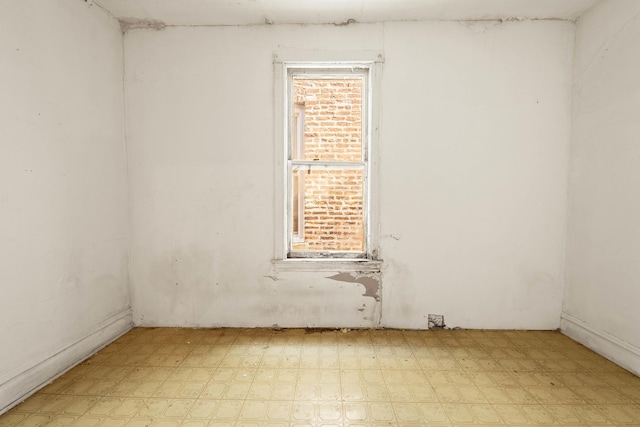 spare room featuring light floors