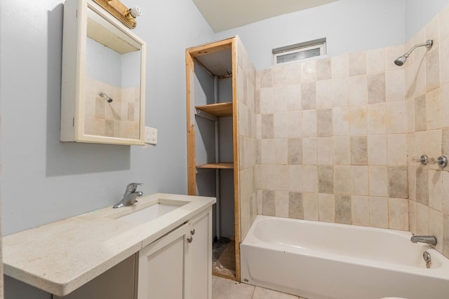 bathroom featuring tile patterned floors, vanity, and bathing tub / shower combination