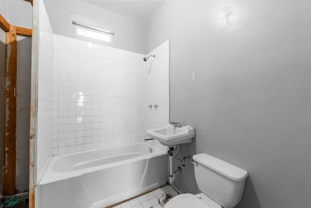 full bath featuring shower / bathtub combination, toilet, and tile patterned floors