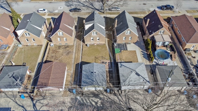 birds eye view of property with a residential view