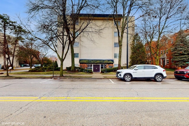 view of property with uncovered parking