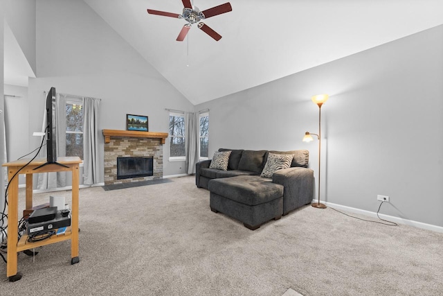 living room featuring high vaulted ceiling, a fireplace with flush hearth, a ceiling fan, baseboards, and carpet