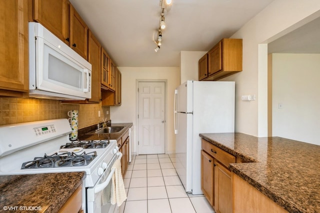 1501 E Churchill Dr Unit 104, Palatine, IL 60074 - kitchen with a sink, tasteful backsplash, white appliances, and brown cabinets