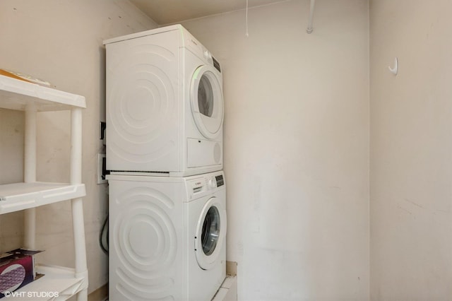 1501 E Churchill Dr Unit 104, Palatine, IL 60074 - clothes washing area with stacked washer / dryer and laundry area