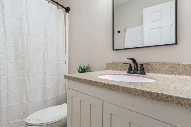 full bath with toilet and vanity