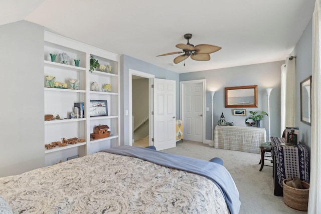 bedroom featuring light colored carpet, a ceiling fan, and vaulted ceiling