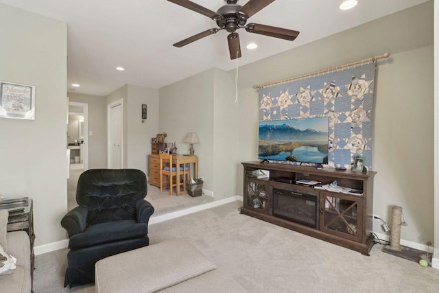 living area featuring carpet flooring, a ceiling fan, recessed lighting, and baseboards