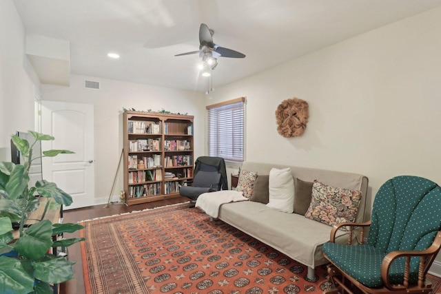 interior space featuring visible vents, a ceiling fan, and wood finished floors