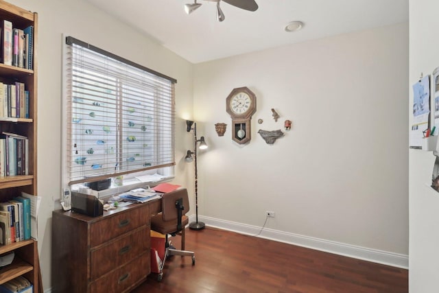 office area with a ceiling fan, baseboards, and dark wood-style flooring