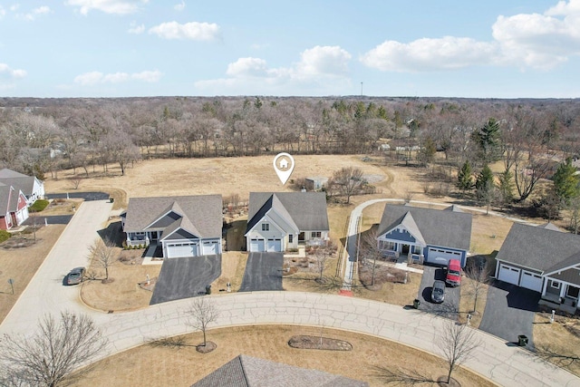 birds eye view of property with a residential view