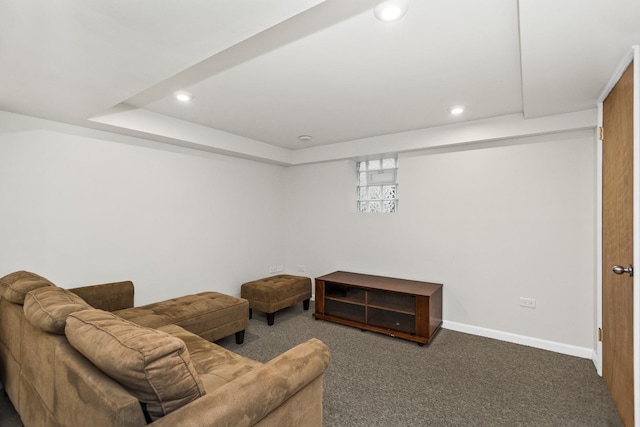 carpeted living area featuring baseboards and recessed lighting