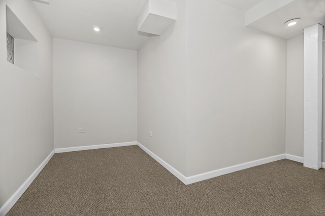 carpeted spare room with recessed lighting and baseboards