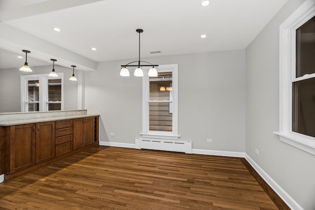 interior space with a baseboard radiator, dark wood finished floors, baseboards, and recessed lighting