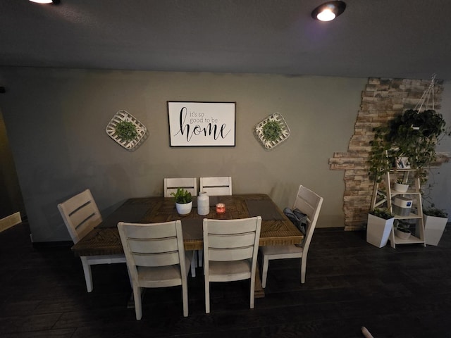 dining area featuring wood finished floors