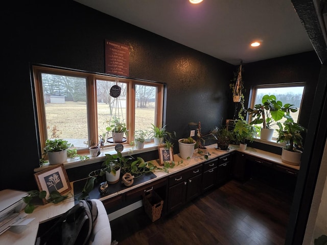 bathroom featuring recessed lighting, a textured wall, and wood finished floors