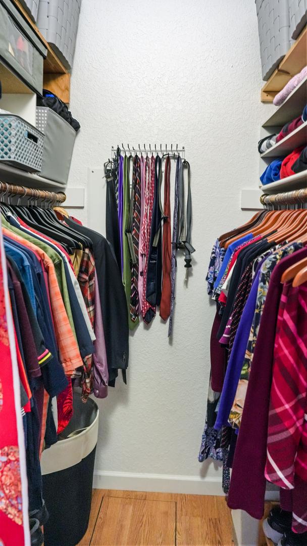 walk in closet featuring wood finished floors