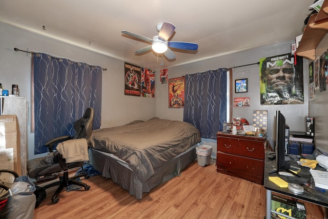 bedroom with ceiling fan and wood finished floors