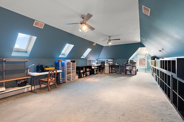 carpeted office space with lofted ceiling and visible vents