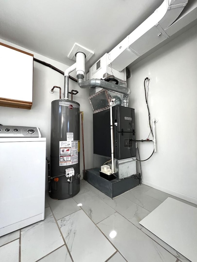 utility room featuring washer / clothes dryer, visible vents, and gas water heater