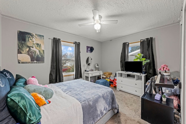 carpeted bedroom featuring a textured ceiling, multiple windows, and a ceiling fan