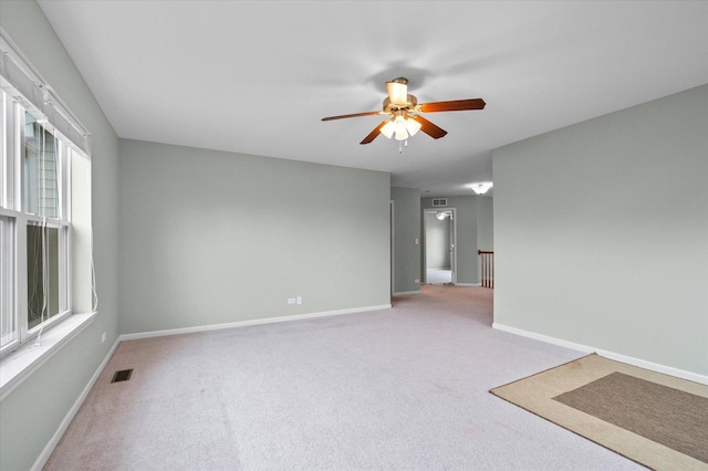 117 Preakness Dr, Oswego, IL 60543 - carpeted spare room featuring a ceiling fan, baseboards, and visible vents