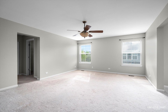 117 Preakness Dr, Oswego, IL 60543 - empty room with light colored carpet, a ceiling fan, and baseboards