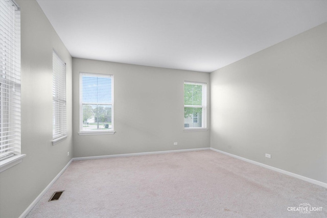 117 Preakness Dr, Oswego, IL 60543 - carpeted spare room with visible vents and baseboards