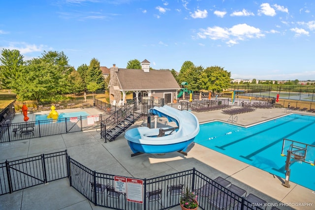 117 Preakness Dr, Oswego, IL 60543 - community pool featuring a patio area, a water slide, and fence