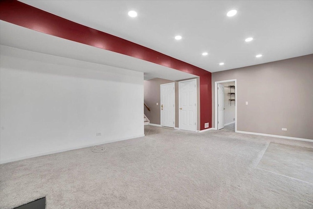 interior space with recessed lighting, stairway, baseboards, and light colored carpet