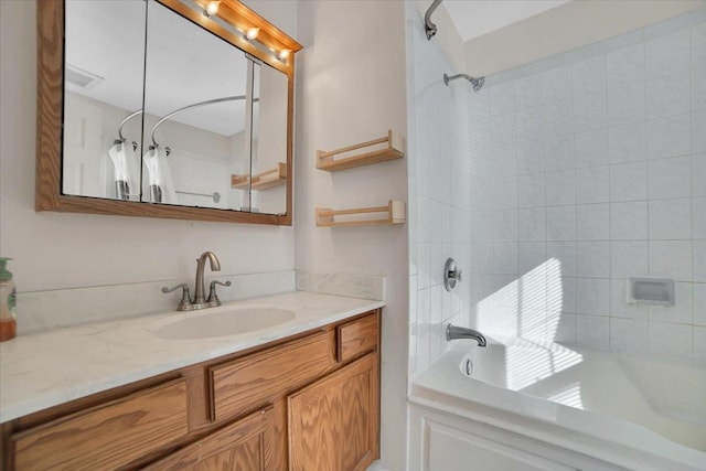 bathroom with washtub / shower combination and vanity