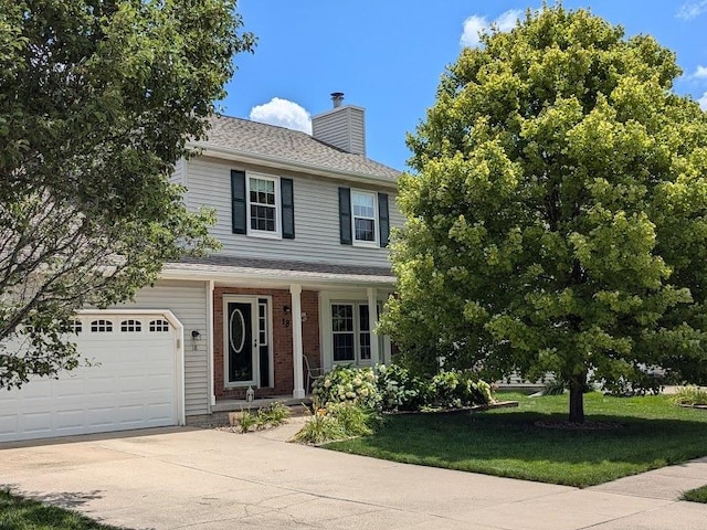 view of front of property with a garage, brick siding, concrete driveway, a front lawn, and a chimney