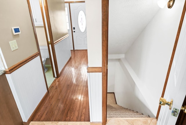 interior space with wood-type flooring and a textured ceiling