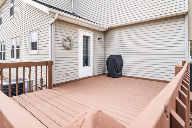 deck with central AC and area for grilling