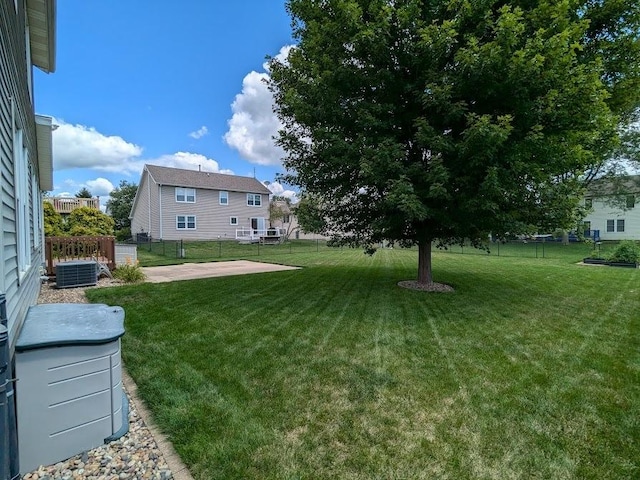 view of yard with a patio area, fence, and cooling unit