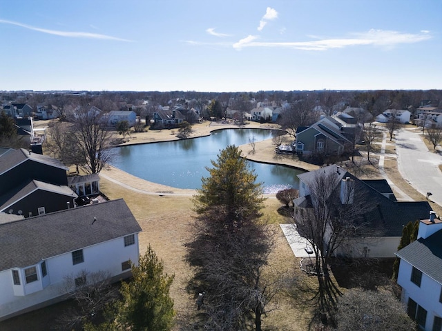 drone / aerial view with a water view and a residential view