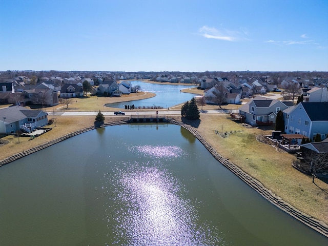 bird's eye view featuring a residential view and a water view