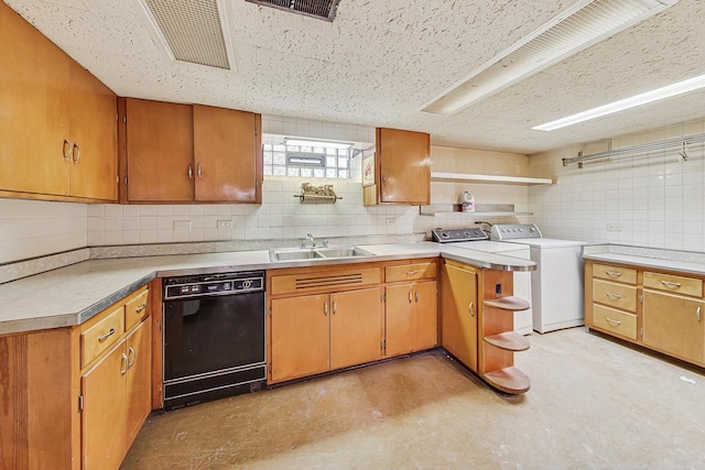 kitchen featuring open shelves, washer / clothes dryer, a sink, dishwasher, and backsplash