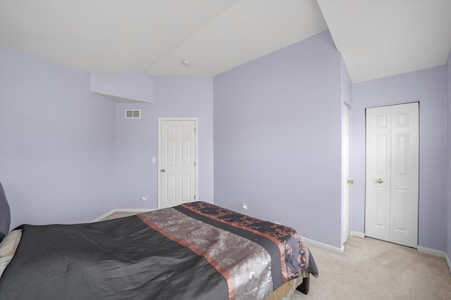 bedroom with light carpet, baseboards, and visible vents